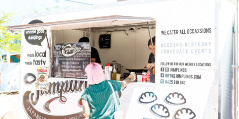 Person ordering from a food truck