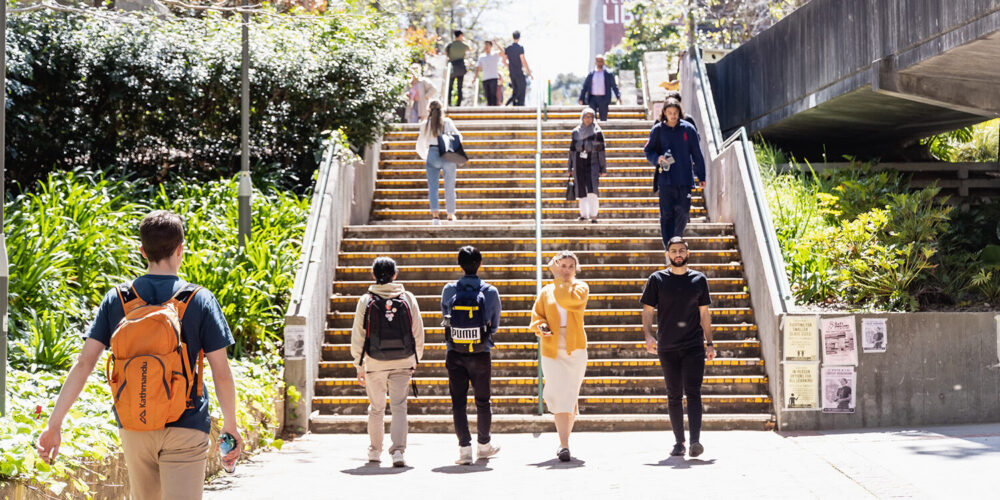 Groups of students using stairs - play video