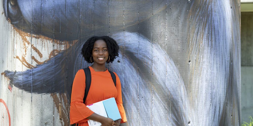 Student holding documents