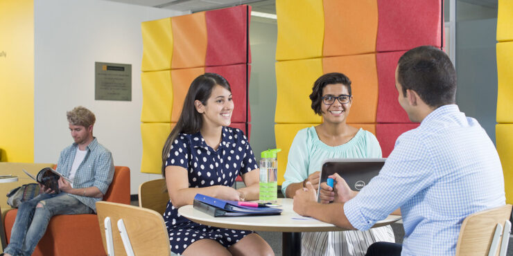 students speaking to each other at a table