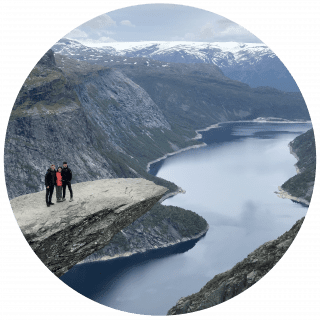 People standing in front of a large river