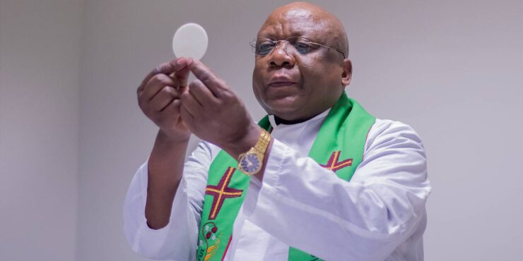 Catholic priest conducting Eucharist